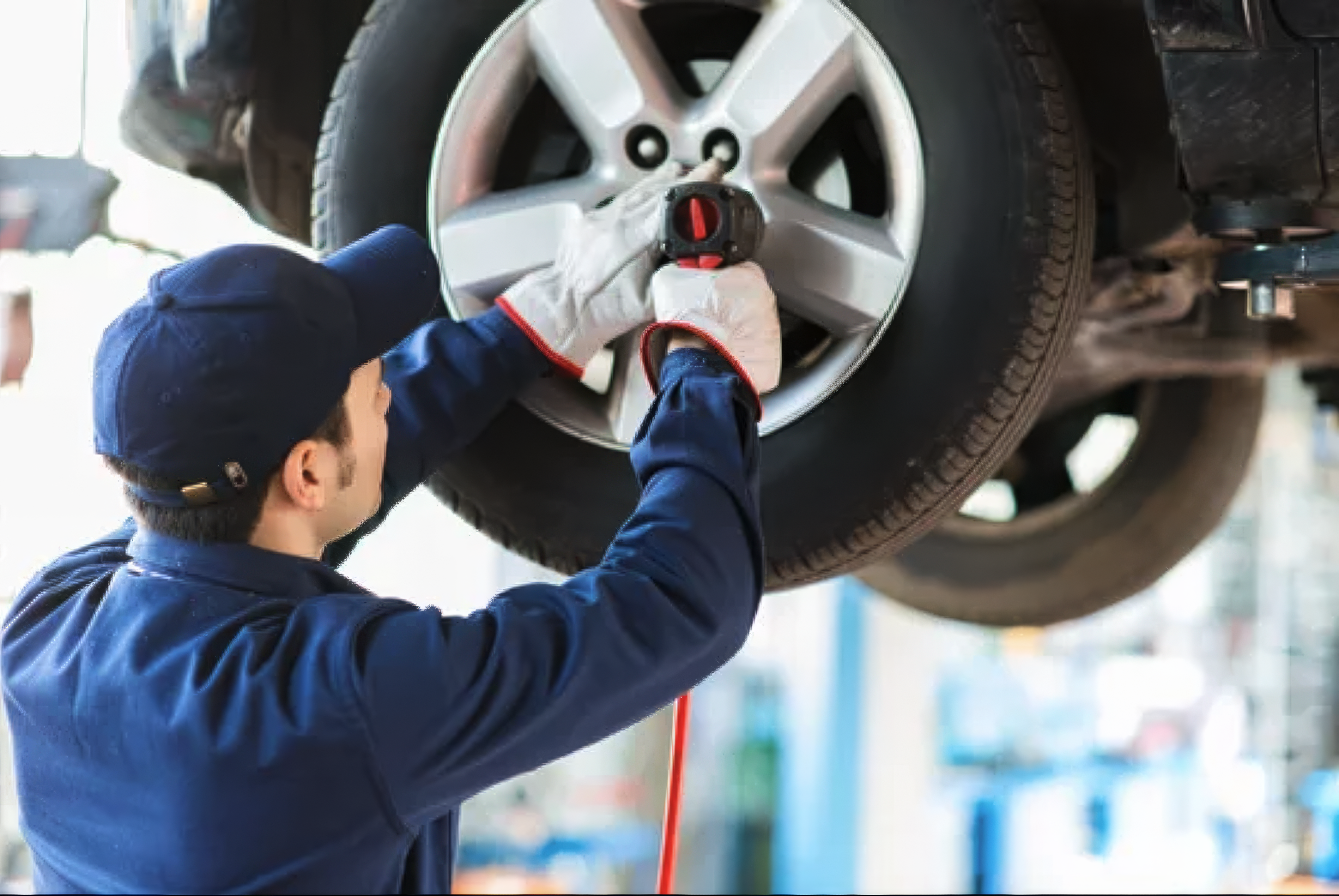 Tire shop Koreatown Los Angeles — technician mounting tire at Western Auto Glass and Tire