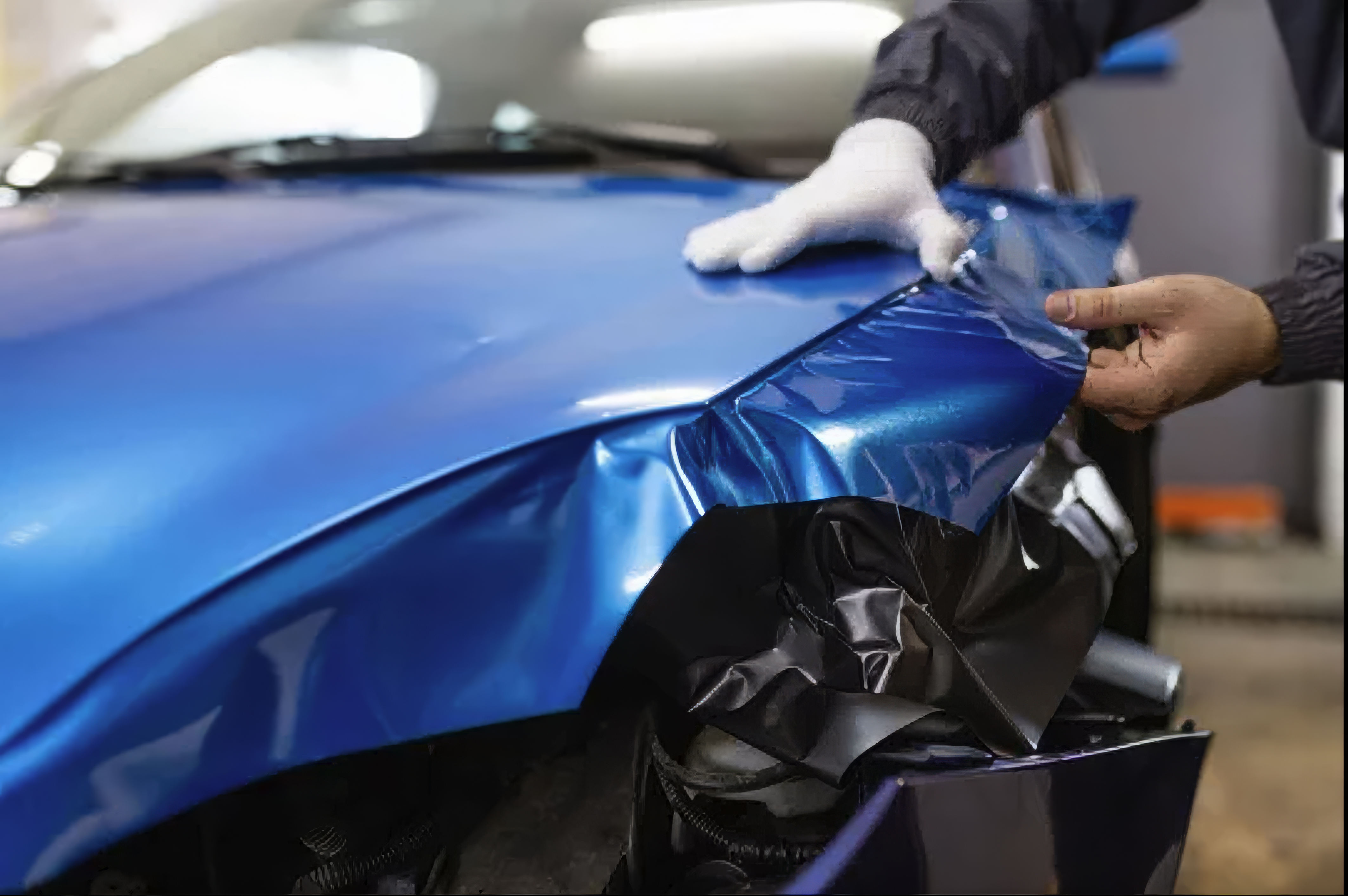 Blue vehicle wrap applied to car hood Los Angeles Koreatown Western Auto Glass and Tire